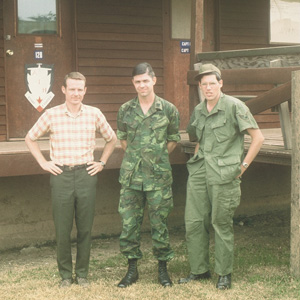 David's roomates, Gary Haws (in civilian clothes) and Roger Witte (center), with another serviceman