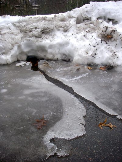 The rain on the snow in the driveway The rain on the snow in the driveway