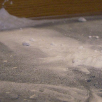 The baking soda spilled on the kitchen floor The baking soda spilled on the kitchen floor