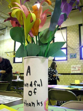 Handprint flowers on the tables of the volunteer luncheon